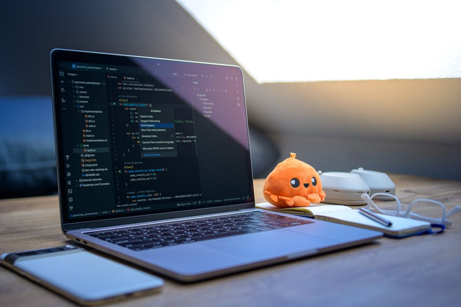 A cozy workspace featuring a laptop displaying code